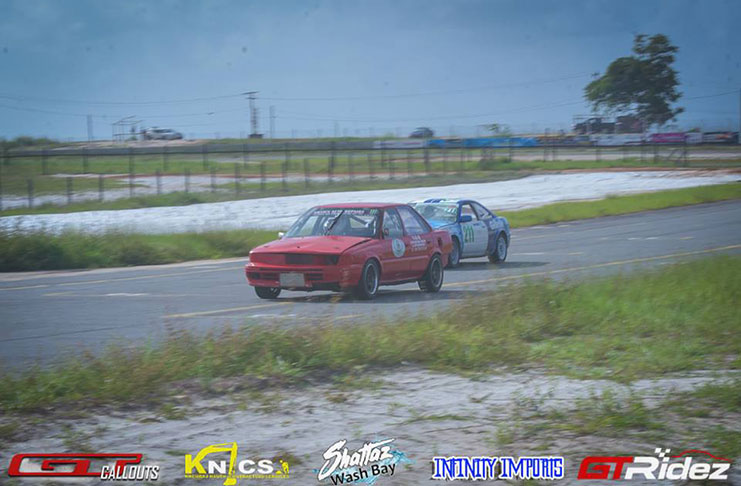 In this GTRidez photo, Sean Bacchus (red car) and Adrian Fernandes battle for the lead of the Endurance Championship.