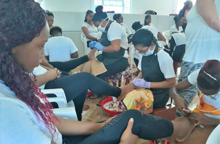 Students involved in the cosmetology course