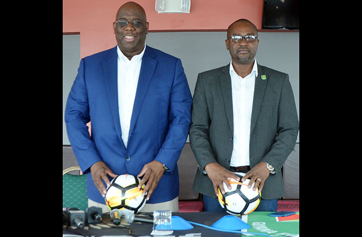 CONCACAF Senior Project manager Howard McIntosh (L) and GFF president Wayne Forde