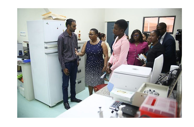 Public Health Minister Volda Lawrence talks with Muniram Balgobin ,Medical Laboratories Manager, during a recent visit to the medical lab at the Mahaicony Hospital.(DPI photo)