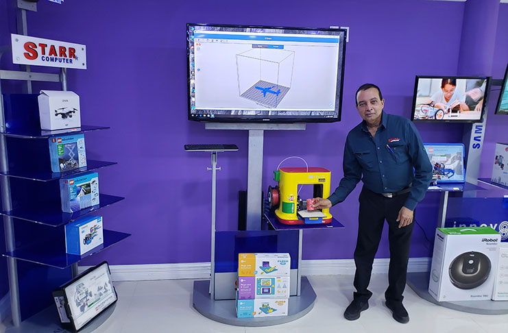 Mohan displays an item created by a portable 3D printer on display in the Innovation Centre