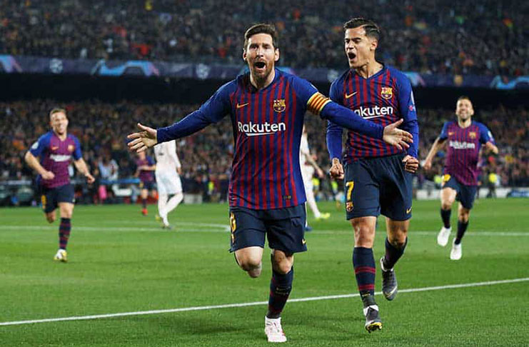 Barcelona's Lionel Messi celebrates scoring their first goal with Philippe Coutinho.