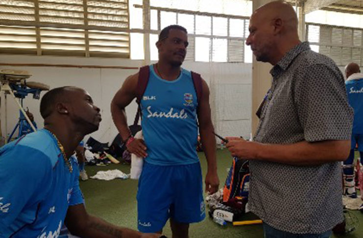 CWI president Ricky Skerritt engages the attention of West Indies fast bowlers Kemar Roach (left) and Shannon Gabriel during Monday’s day one of the training camp at 3W’s Oval. (Photo courtesy CWI Media)