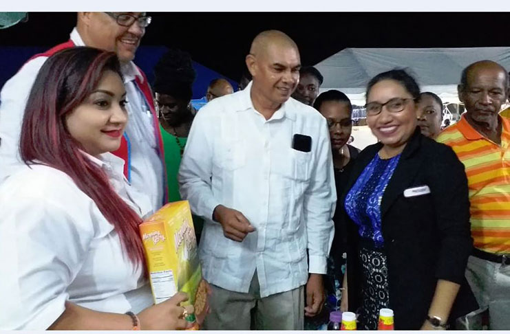 Minister of Business, Haimraj Rajkumar, along with President of the Essequibo Chamber of Commerce Ms. Suean Sewnaryan being briefed about the IAST products