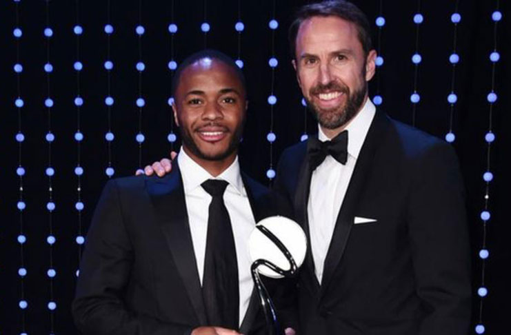 Raheem Sterling( left) received his award from England manager Gareth Southgate