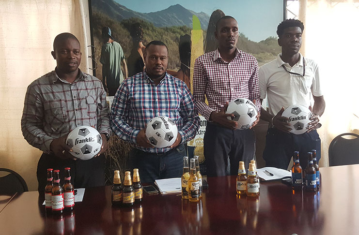 Petra co-director Troy Mendonca, second from left, stands with Top Brandz Brand manager Colin Stuart. The two are flanked by Sean Embrack (extreme left) and Mark Alleyne. (Stephan Sookram photo)