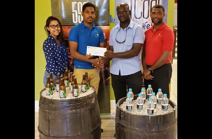 At the launch of the tournament, from left, Ansa McAl’s Marketing Assistant Gabriell Lopes, 592 Beer Brand Coordinator Seweon McGarrell, Samuel Kingston and Ansa McAl’s Business Unit Head Non-Alcoholic Division - Errol Nelson.