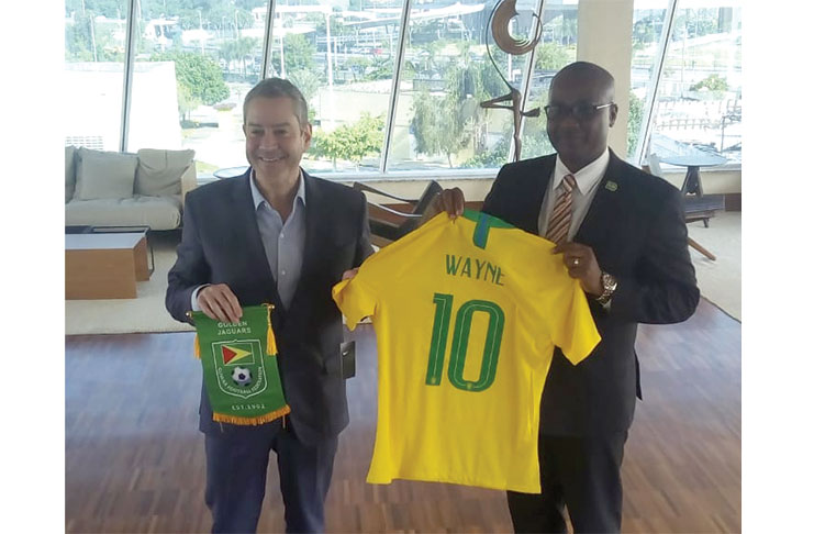 GFF president Wayne Forde displays his custom-made Brazilian jersey, presented to him by CBF president Rogerio Caboclo.