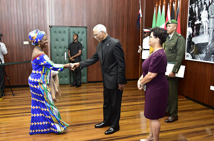 President David Granger accepts the Letters of Credence from the new High Commissioner of Ghana to Guyana, Professor Abena Pokua Adompim Busia, at the Ministry of the Presidency on Wednesday (Adrian Narine Photo)