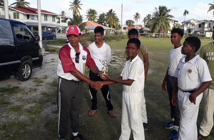 Rajindra Ramballi receives his prize after an outstanding performance.
