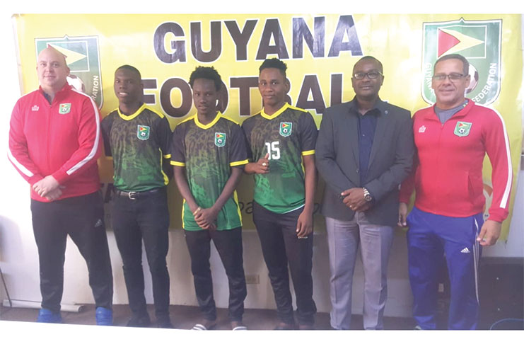 GFF president Wayne Forde (2nd right) pictured with the players and other officials. From right are Toledo Wilson (Director of Coaches Education), Ryan Hackett, Kelsey Benjamin, Ryan Hackett and GFF Technical Director, Ian Greenwood.