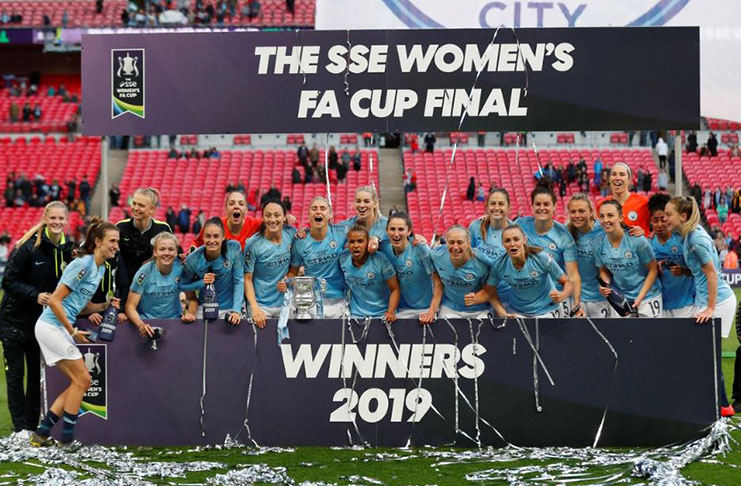 Manchester City players celebrate winning the Women's FA Cup, with the trophy. (Action Images via Reuters/Peter Cziborra)