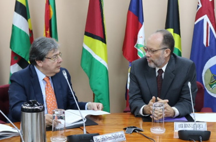 CARICOM Secretary-General, Ambassador Irwin LaRocque (right), in discussion with Colombia's Foreign Minister, His Excellency Carlos Homes Trujilo Gracia, at the Headquarters of the CARICOM Secretariat, Georgetown, Guyana, Thursday