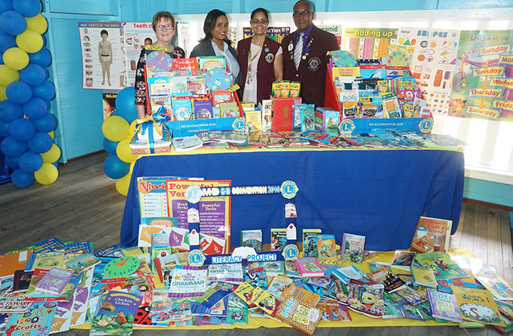Lions Club Multiple District 60 on Friday donated a collection of books and other educational materials to the Ketley Primary School, in Charlestown. In the picture are: (from left) Lions Club International Director, Patricia Vannett; Headteacher of Ketley Primary School, Choline Singh; Program Chairperson for the Reading Action Program, Taramatee Naraine; and Chair of the Council of Governors, Sherwin Greenidge (Elvin Croker photo)