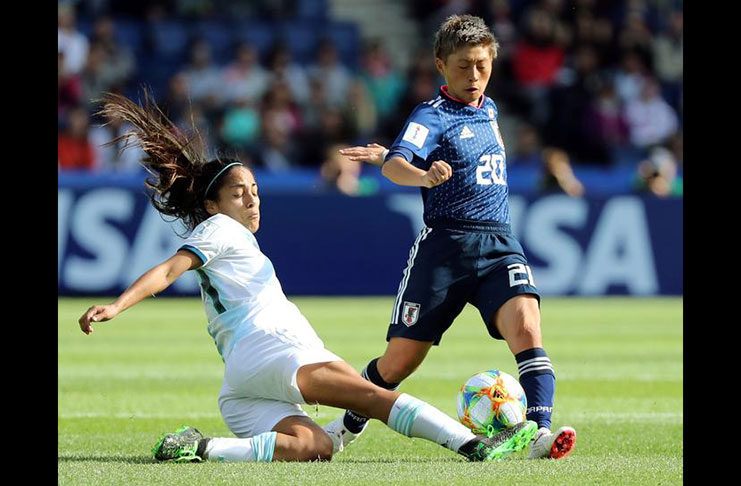 Japan's Kumi Yokoyama in action with Argentina's Miriam Mayorga REUTERS/Lucy Nicholson