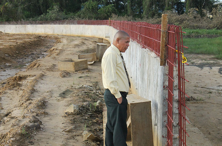 Minister Norton inspects works being executed at the Berbice site of the Synthetic Track Project, during an unplanned visit to the facility last Wednesday.