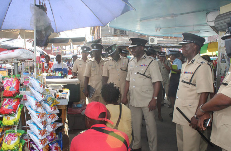 (From Right) Divisional Commander Marlon Chapman, Commissioner of Police Leslie James and the team of Senior Officers during the walkabout