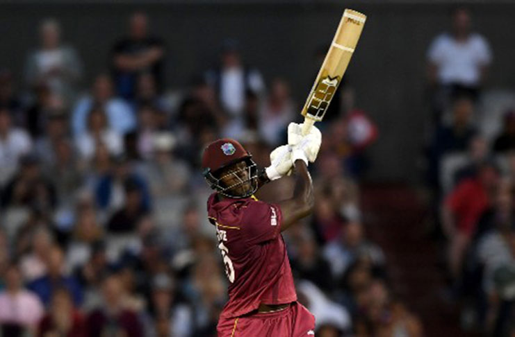 West Indies’ Carlos Brathwaite goes on the attack during his 101 against New Zealand at Old Trafford