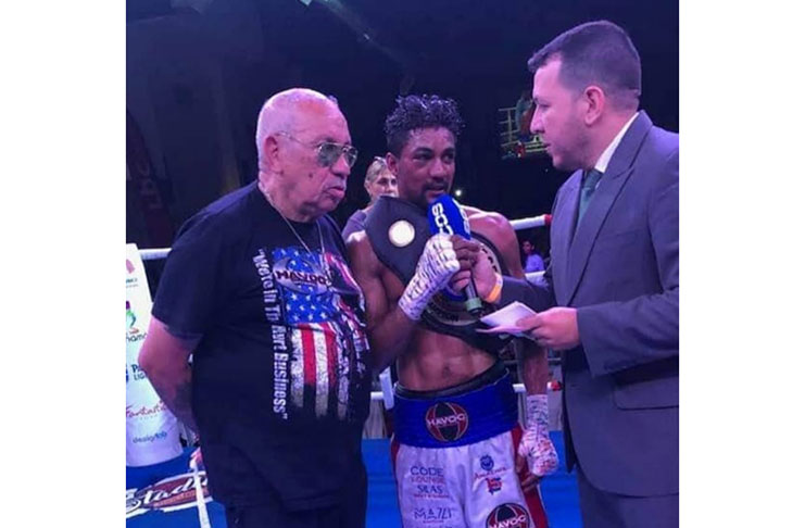 The champion Elton Dharry gives an interview after his fight