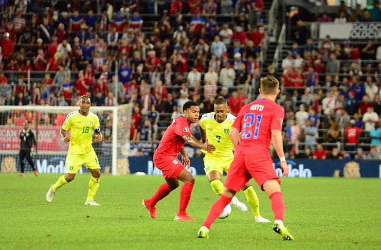 Guyana's Keanu Marsh-Brown battling his way past the USA's Weston McKennie and Tyler Boyd during their clash at the Allianz Field in the CONCACAF Gold Cup on Tuesday night.