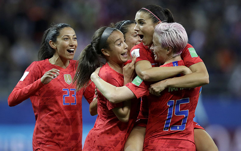 Alex Morgan (second right) celebrates after scoring the United States' 12th goal during the team's 13-0 win over Thailand yesterday.