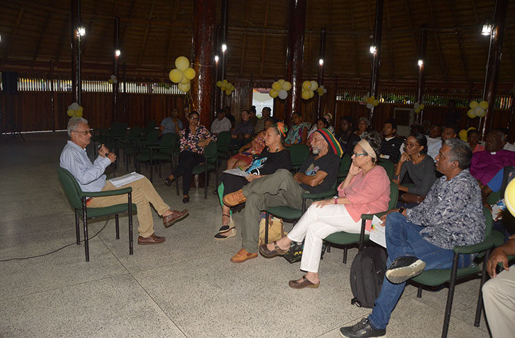 Former Minister, Dr. Rupert Roopnarine interacting with the audience at his lecture on Art in Guyana [Adrian Narine photo]