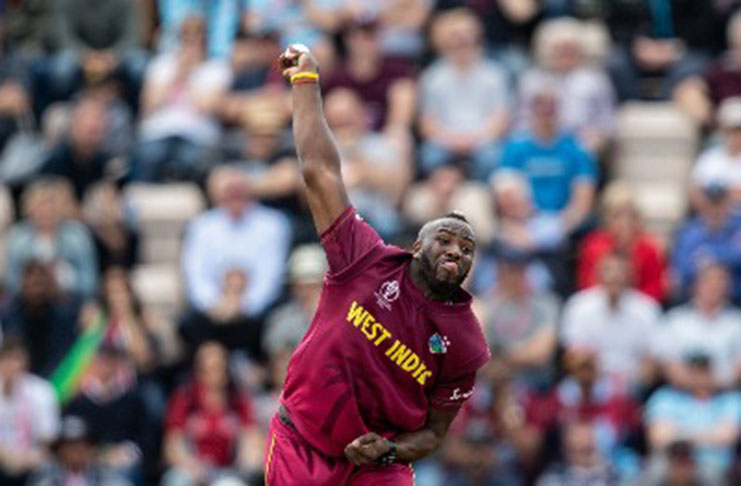 All-rounder Andre Russell sends down a delivery during his two-over spell against England yesterday.