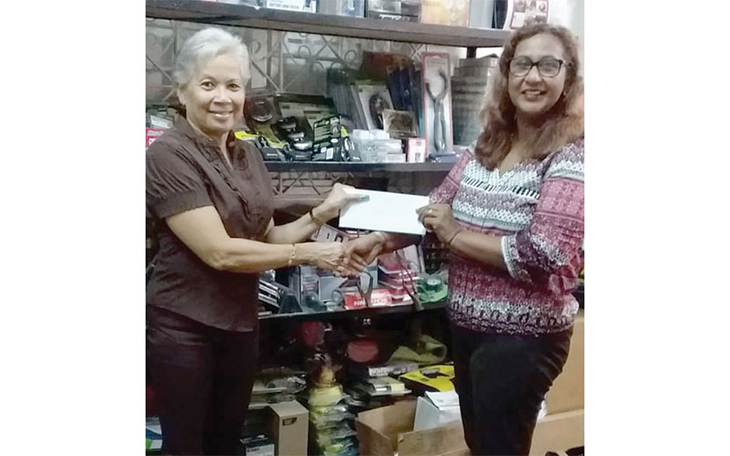 Special Auto’s Kamini Seejatan hands over sponsorship to the GMR&SC’s Cheryl Gonsalves for the second round of the GMR&SC Drag Race championship