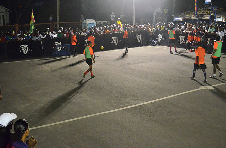 Action in the earlier group stage of the Guinness 'Greatest of the Streets' Georgetown Championship