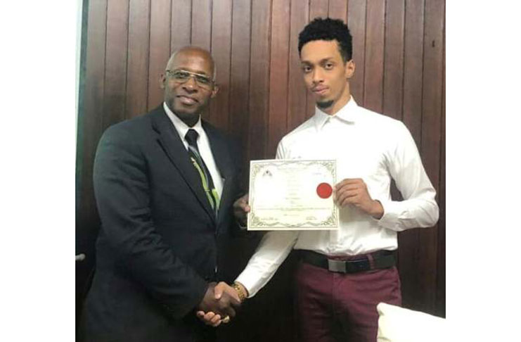 CEO of the radio station, Ryan Benschop (right) alongside Chairman of the Guyana National Broadcasting Authority (GNBA) Leslie Sobers moments after the station received its radio license.
