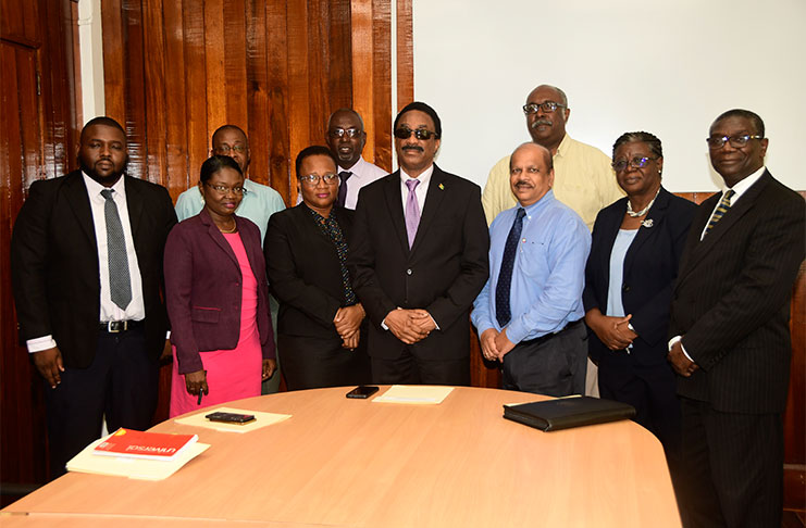 Attorney General and Minister of Legal Affairs, Basil Williams standing with officials of the various government agencies that signed MOUs with the FIU to allow for easy access to information in the fight against money laundering and terrorist financing (Adrian Narine)