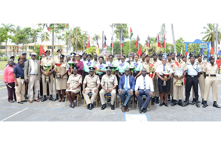 Commissioner of Police, Leslie James (centre) flanked by his deputies and awardees at the ceremony