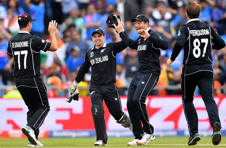 Martin Guptill's direct hit run out of MS Dhoni secures a spot in the World Cup final for New Zealand (AFP)