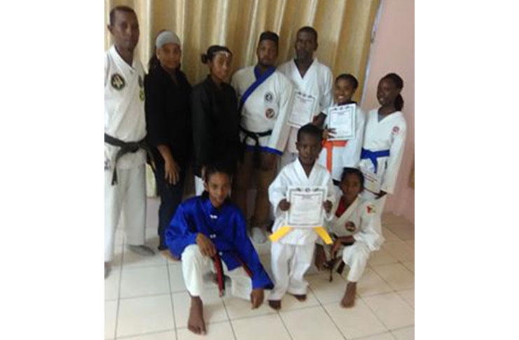 The karatekas and instructors pose after the grading exercise.