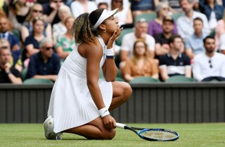 All England Lawn Tennis and Croquet Club, London, Britain - July 1, 2019 Japan's Naomi Osaka reacts during her first round match against Kazakhstan's Yulia Putintseva REUTERS/Tony O'Brien