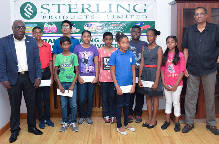 Chief Executive Officer (CEO), of Sterling Company Limited Mr. Ramsay Ali, and Chief Education Officer, Dr. Marcel Hutson with the awardees.
