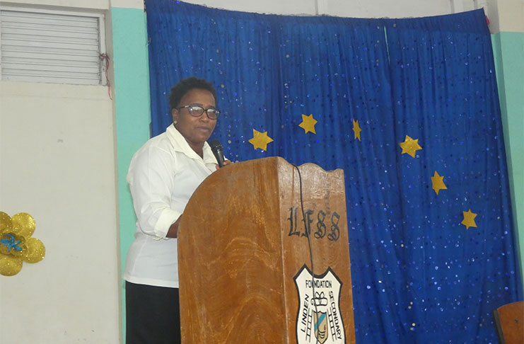 Minister Annette Ferguson addressing the community meeting in Amelia's Ward, Linden