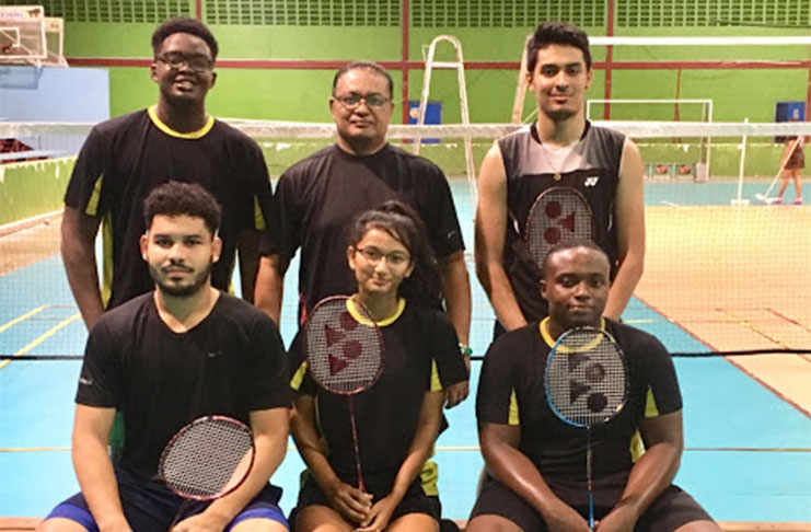 Guyana’s badminton team with coach/manager Gokarn Ramdhani (centre)