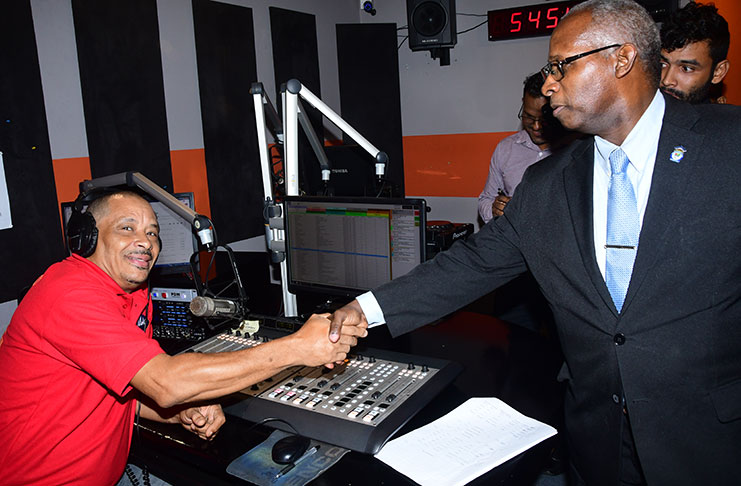 GNBA Chairman Leslie Sobers meeting staff at Mix FM’s main studio after the launch