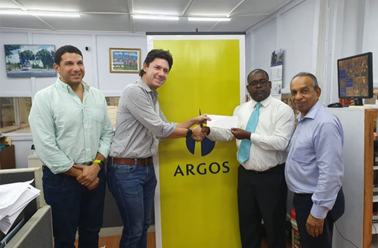 From left, Jose Guillermo Araujo (Marketing Rep Argos), Juan Gonzales (Head of Marketing Argos), Ramesh Persaud (president of Santos FC) and Edward Boyer (CEO of National Hardware).