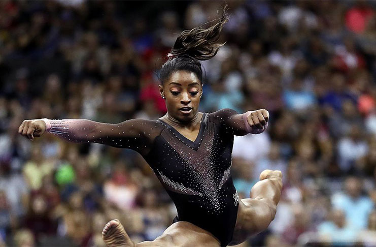 Kansas City, MO, USA; Simone Biles performs during the 2019 U.S. Gymnastics Championships at Sprint Center. Mandatory Credit: Jay Biggerstaff-USA TODAY Sports