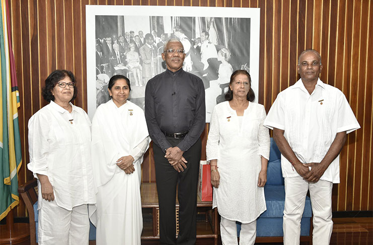 President David Granger (centre) with Ms. Paramdai Persaud, Ms. Sita Narine and Mr. Stanley Singh of the Brahma Kumaris Raja Yoga Centre, Wednesday morning, at the Ministry of the Presidency