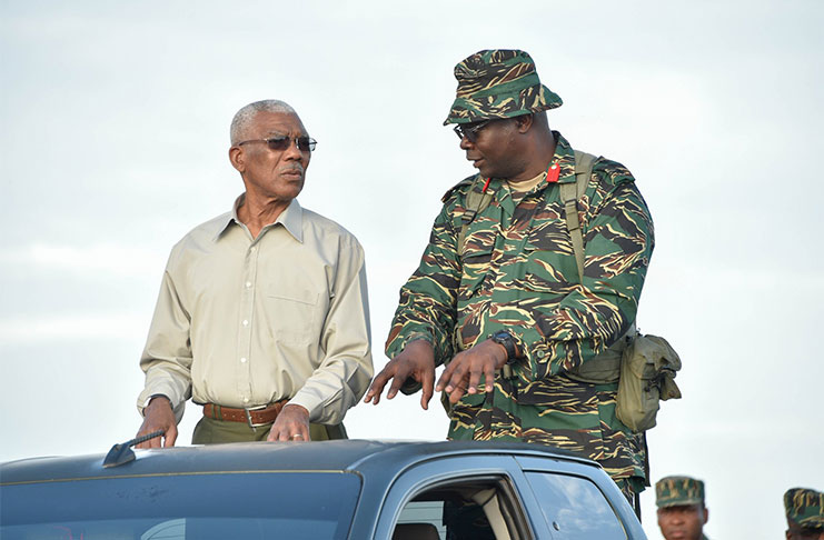 President David Granger being briefed during the execution of the Field Tactical Exercise ‘EXERCISE GREENHEART’. — at Tacama, Upper Demerara-Berbice