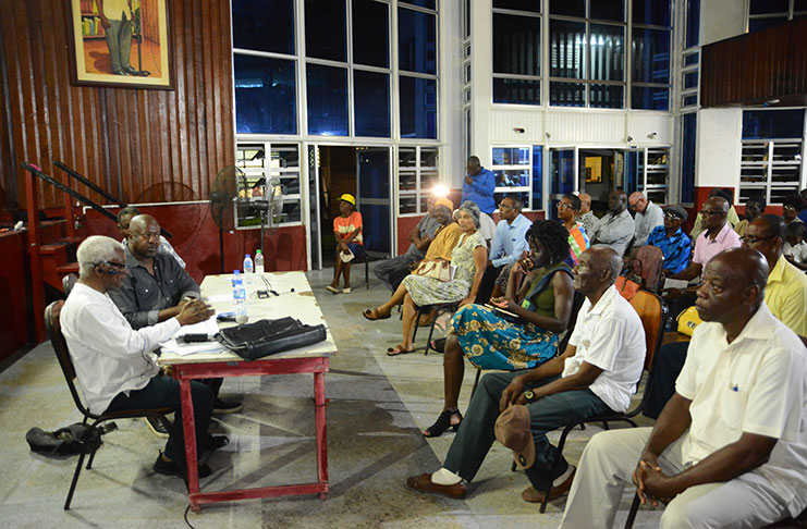 Members of the head table (L-R): Professor Clive Thomas; WPA Executive Member, David Hinds and General Secretary of the Guyana Trades Union Congress (GTUC), Lincoln Lewis meet with several interested persons at the WPA’s Public Symposium on Monday (Samuel Maughn photo)