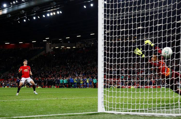 Manchester United's Daniel James scores the decisive penalty. (Action Images via Reuters/Jason Cairnduff)