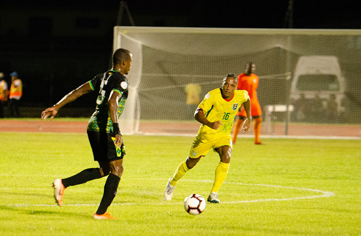 Guyana's Neil Danns on the defensive end against Jamaica at the National Track and Field Centre. (Delano Williams photo)
