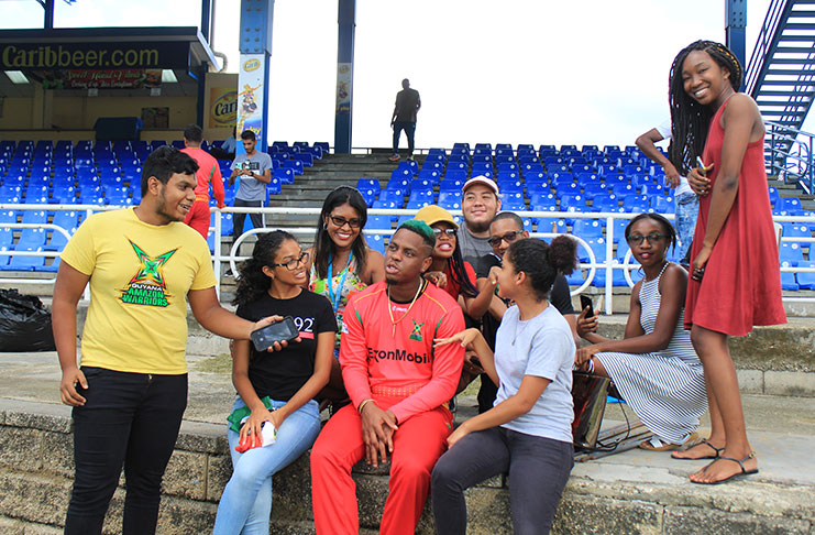 Guyanese students in Trinidad interacting with Guyanese ace batsman Shimron Hetmyer 