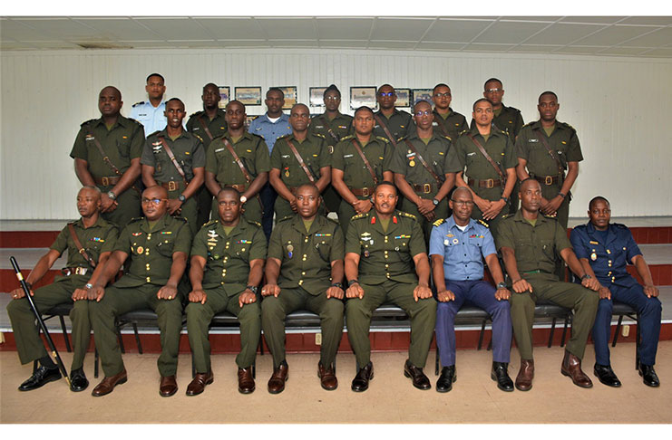 (Seated) senior officers flanked by the 15 Lieutenants that graduate in Junior and Command Staff Course