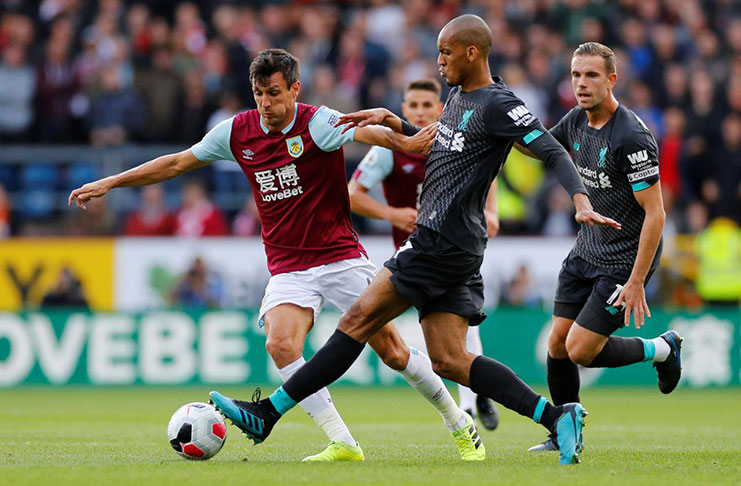 Burnley's Jack Cork in action with Liverpool's Fabinho and Jordan Henderson at Burnley, Britain  (REUTERS/Phil Noble)