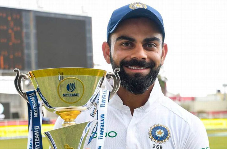 Skipper  Virat Kohli poses with the series trophy  after his teams’ victory at Sabina Park , yesterday. But it   was also India’s 28th Test victory under Virat Kohli, making him the winning-est Indian Test captain, going past MS Dhoni's 27. ( AFP)